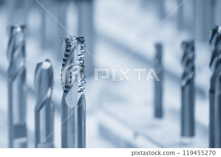 Close-up scene the group of new rough cutter end mill tool in the light blue scene. Close-up scene the group of new rough cutter end mill tool in the light blue scene. 119455270