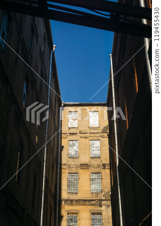 industrial architectural background, vintage buildings of an old factory workshops industrial architectural background, vintage buildings of an old factory workshops 119455430