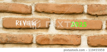 Planning review 2025 new year symbol. Concept words Review 2025 on beautiful brown brick wall. Beautiful brown brick wall background. Business review 2025 new year concept. Copy space. 119455959
