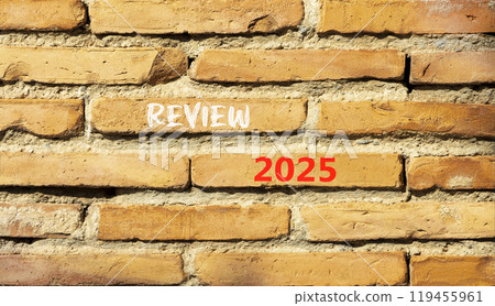 Planning review 2025 new year symbol. Concept words Review 2025 on beautiful brown brick wall. Beautiful brown brick wall background. Business review 2025 new year concept. Copy space. 119455961