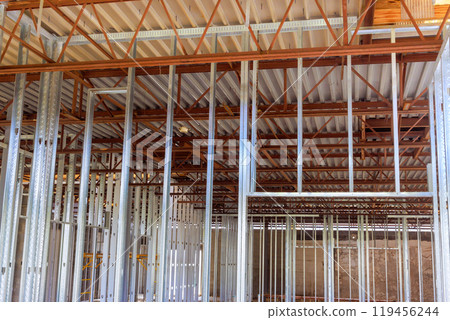 Frames made steel beams profiles are used in construction of large commercial buildings 119456244