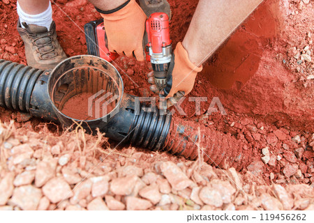 In order to repair damaged drainage system for collecting rainwater, underground storm sewer pipes must be replaced. 119456262