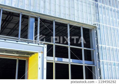 Frames made steel beams are used in construction of large commercial buildings Frames made steel beams are used in construction of large commercial buildings 119456292