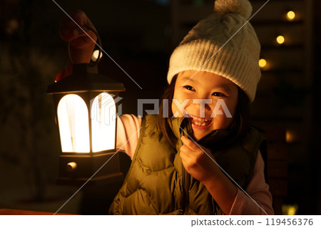 Children camping on a balcony on a winter night (outdoor veranda camping) 119456376