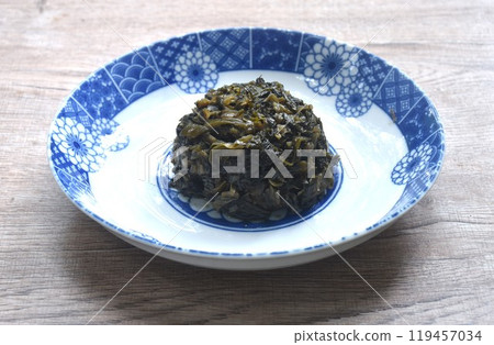 stir fried pickled mustard or Gan Lan Cai Chinese food made from cabbage and black olive in oil on plate  119457034