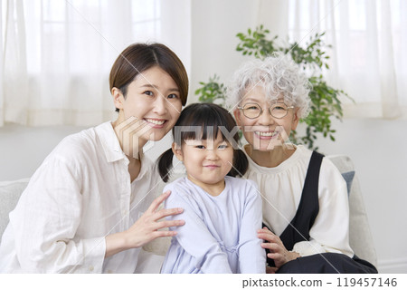 Three generation portrait living room 119457146