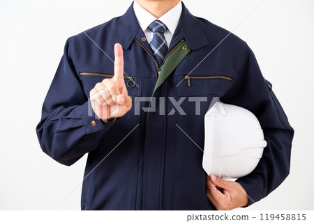 A middle-aged male businessman in work clothes pointing up his index finger A middle-aged male businessman in work clothes pointing up his index finger 119458815