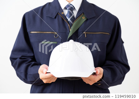 Middle-aged male businessman in work clothes Middle-aged male businessman in work clothes 119459010