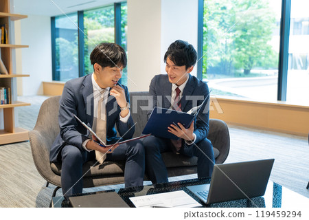Two male businessmen having a meeting Two male businessmen having a meeting 119459294