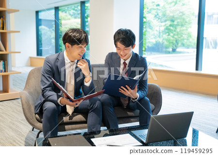 Two male businessmen having a meeting Two male businessmen having a meeting 119459295