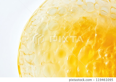 Yellow Bubble Reflecting Light on White Background 119461095