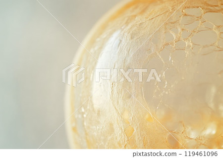 Bright Yellow Bubble Highlighting Unique Surface Features Bright Yellow Bubble Highlighting Unique Surface Features 119461096