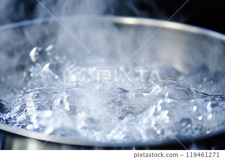 Close-Up of Water Boiling Vigorously in Steel Pot Close-Up of Water Boiling Vigorously in Steel Pot 119461271