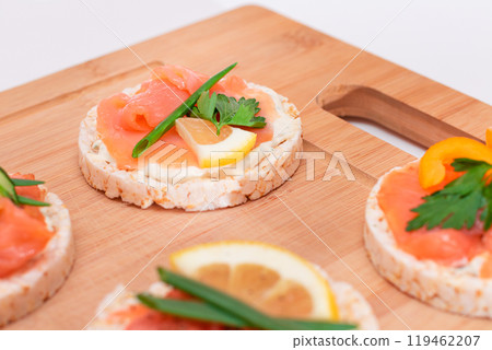 Rice Cake Sandwiches with Fresh Salmon, Cucumber, Lemon and Greens Rice Cake Sandwiches with Fresh Salmon, Cucumber, Lemon and Greens 119462207
