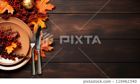 Autumn-inspired Thanksgiving banner with a rustic table setting, including fall leaves and berries. Copy space 119462340