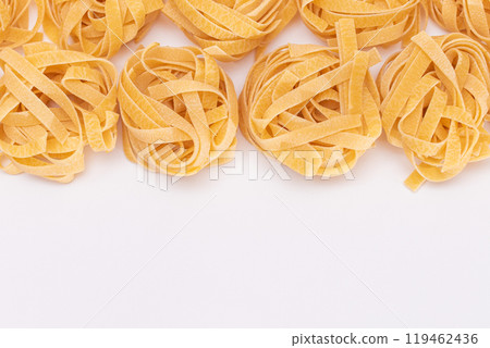 Classic Italian Raw Egg Fettuccine on White Background 119462436