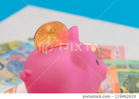 Pink Piggy Bank with Bitcoin Coin on the Euro Banknotes Pink Piggy Bank with Bitcoin Coin on the Euro Banknotes 119462619
