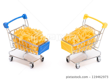 Uncooked Fusilli Pasta in Two Small Shopping Carts Isolated on White Uncooked Fusilli Pasta in Two Small Shopping Carts Isolated on White 119462973