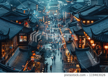 A city street at night with many lanterns and signs 119463026