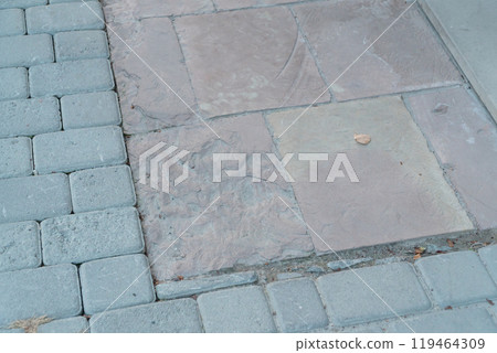 Serene Pathway with Blended Textures of Pavers and Slabs 119464309