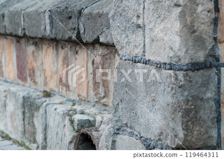 Textured Stone Wall with Unique Patterns and Subtle Color Contrast 119464311