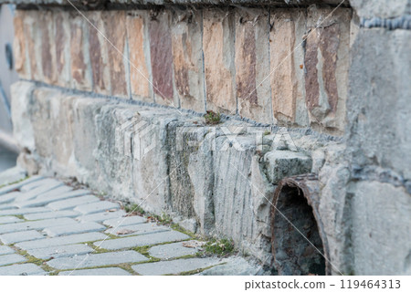 Beautifully Textured Stone Wall with Curb and Drainage System Beautifully Textured Stone Wall with Curb and Drainage System 119464313
