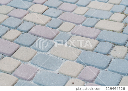 Cobblestone Pathway with Soft Pastel Colors in Urban Setting 119464326