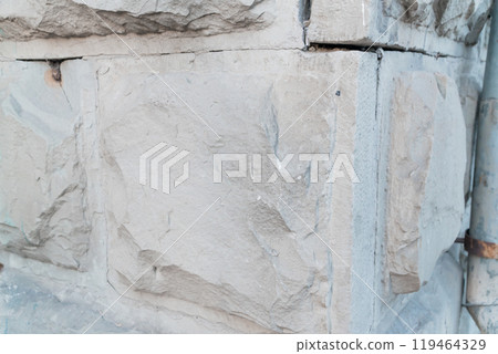 Textured Stone Wall Corner with Subtle Color Variations 119464329