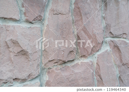 Textured Rustic Brown Stone Wall with Slightly Weathered Appearance Textured Rustic Brown Stone Wall with Slightly Weathered Appearance 119464340