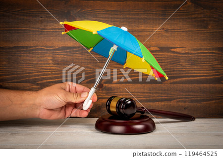 Rule of law and the concept of equality. Judge's gavel on wooden texture background 119464525