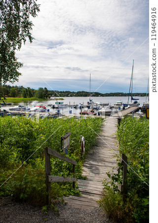Boats in marina in Sweden. yachts, sailboats, dinghies in marina. Boats in marina in Sweden. yachts, sailboats, dinghies in marina. 119464916