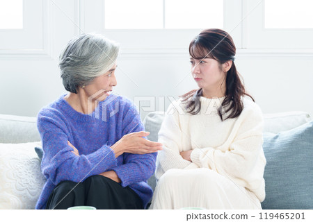 Grandmother and grandson fighting 119465201