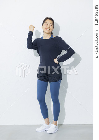 A woman in her 50s stretching 119465598