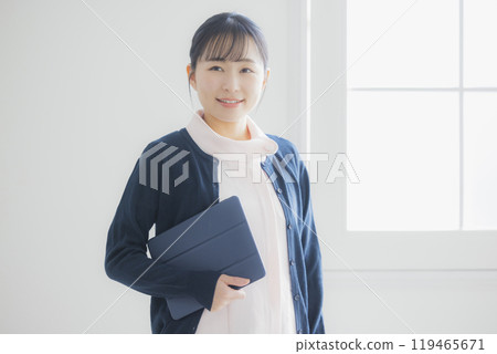 Smiling young nurse woman Smiling young nurse woman 119465671