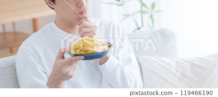 A man wondering whether to eat potato chips (potato chips, diet, gain weight, unhealthy) A man wondering whether to eat potato chips (potato chips, diet, gain weight, unhealthy) 119466190