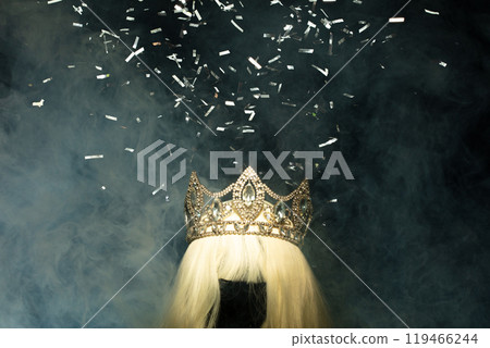 Gold Crown Diamond on hair wig model head. Sparking glitter diamond crown ready to put on winner wear head of Miss Beauty pageant contest. Black background isolated with smoke 119466244