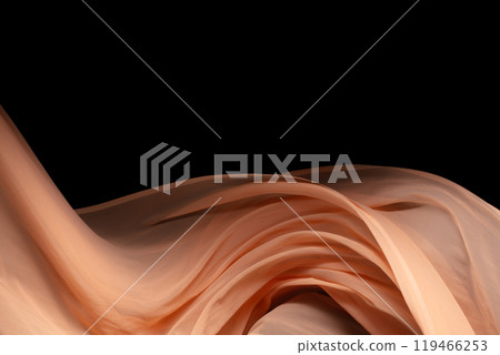 Orange Organza fabric flying in curve shape, Piece of textile Orange Organza fabric throw fall in air. Black background isolated, dark shading environment 119466253