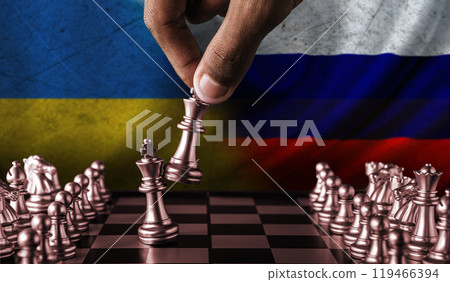 Russia vs Ukraine flag concept on chessboard. Political tension between Russia and Ukraine. Conflict between Russia and Ukraine over chess pieces 119466394