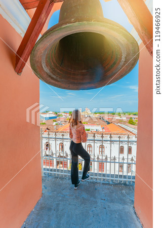 Tourist girl at the viewpoint of the La Merced church with a panoramic view of the Granada cathedral 119466925