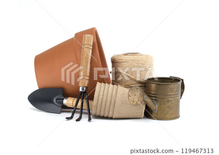 Collection of gardening tools and supplies including pots, trowel, cultivator watering can and twine 119467313