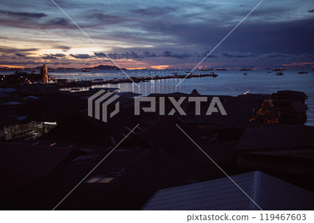 Twilight seascape with the sky and village from the windows of an apartment. Twilight seascape with the sky and village from the windows of an apartment. 119467603