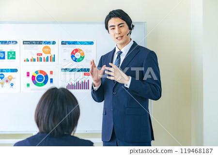 Male business person giving a lecture at a seminar 119468187