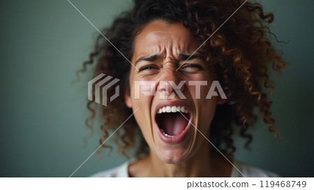 Portrait of woman showing strong emotions for mental health awareness 119468749