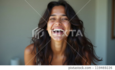 laughing latin american young adult woman with long dark hair laughing latin american young adult woman with long dark hair 119469226