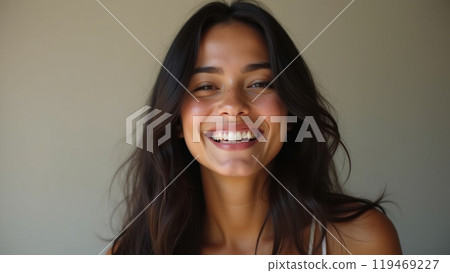 laughing latin american young adult woman with long dark hair laughing latin american young adult woman with long dark hair 119469227