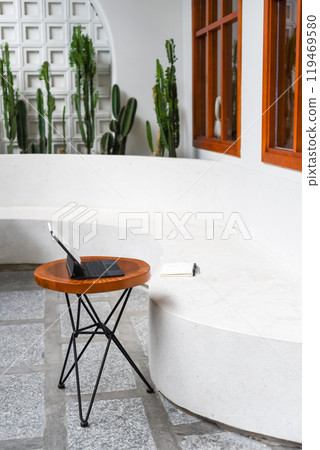 Cozy place for a freelancer or digital nomad with tablet, notebook and pen 119469580