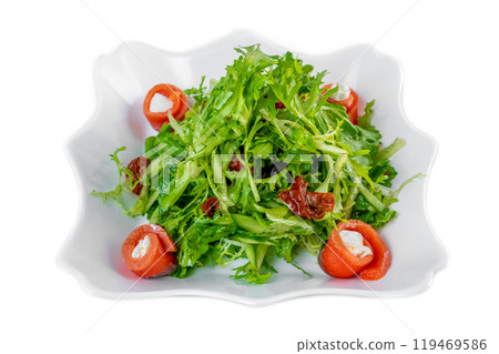 Fresh salad with arugula, salmon, cream cheese and sun-dried tomatoes on white background Fresh salad with arugula, salmon, cream cheese and sun-dried tomatoes on white background 119469586
