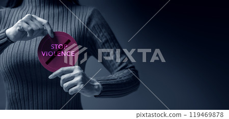 Protest and Expression Concept. Young Women Raised a Word of Stop Violence.  Front View and Dark Dramatic tone 119469878