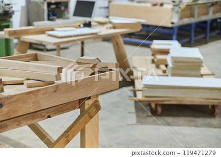 Interior of Wood Processing Industry Featuring CNC Cutting Machines and Wood Processing Equipment 119471279