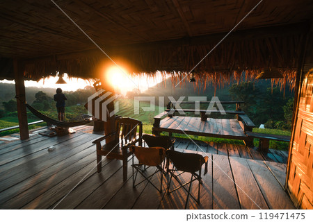 Rural rice field tour, man standing taking pictures on the rice field terrace and morning light 119471475